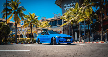 PHUKET, THAILAND- DECEMBER 25, 2023: Beautiful bright blue BMW M3 series in the parking lot.のeditorial素材