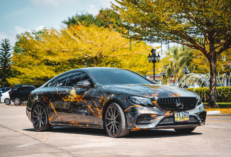 PHUKET, THAILAND- DECEMBER 24, 2023: Beautiful bright Mercedes AMG E53 against of nature with palmsのeditorial素材