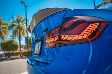 PHUKET, THAILAND- DECEMBER 25, 2023: Beautiful bright blue BMW M3 series in the parking lot.のeditorial素材