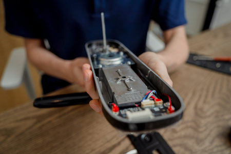 A technician assembles and installs smart electronic door lock for house protection