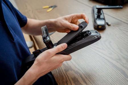 A technician assembles and installs smart electronic door lock for house protection