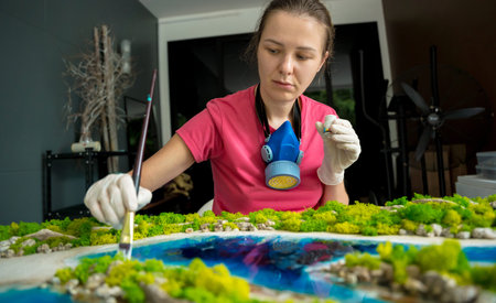 The process of making the art decor of epoxy resin, natural stones and moss