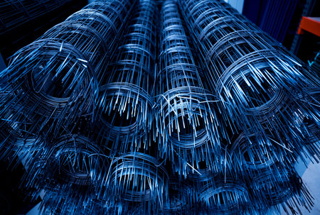A rolls of wire mesh in the showroom of a large store.