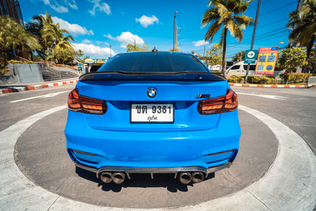 PHUKET, THAILAND- DECEMBER 25, 2023: Beautiful bright blue BMW M3 series in the parking lot.のeditorial素材