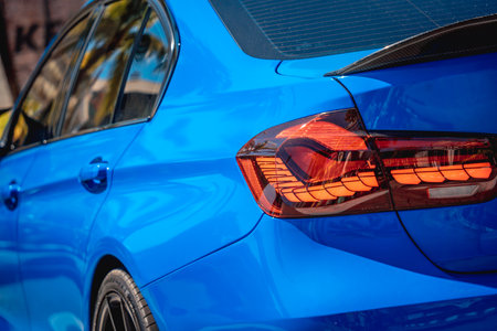 PHUKET, THAILAND- DECEMBER 25, 2023: Beautiful bright blue BMW M3 series in the parking lot.のeditorial素材