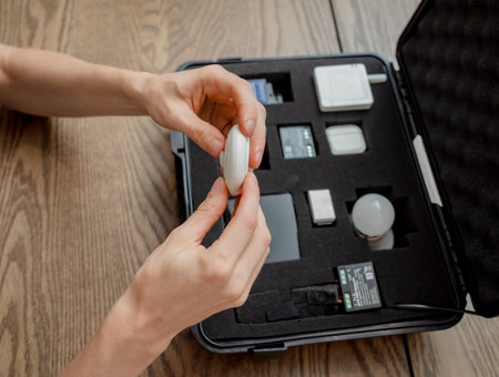 A technician works with a demo kit of the smart home system