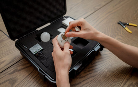 A technician works with a demo kit of the smart home system