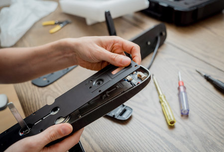 A technician assembles and installs smart electronic door lock for house protection