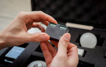 A technician works with a demo kit of the smart home system