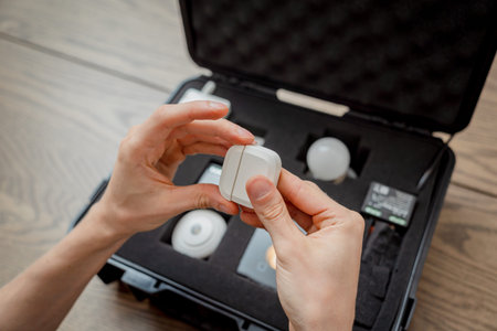 A technician works with a demo kit of the smart home system