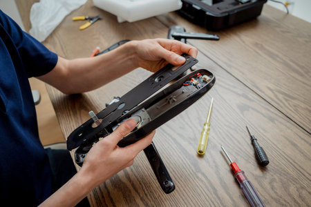 A technician assembles and installs smart electronic door lock for house protection