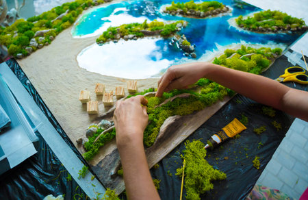 The process of making the art decor of epoxy resin, natural stones and moss