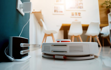 A robot vacuum cleaner at home moving towards the charging station.