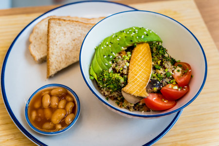Healthy quinoa bowl with avocado, mushrooms and fresh vegetablesの写真素材