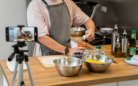 The chef is broadcasting live from workshop how to prepare a vegetarian foodの写真素材
