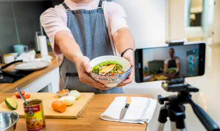The chef is broadcasting live from workshop how to prepare a vegetarian food