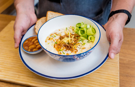 Rice porridge with caramelized onions and sesame seeds