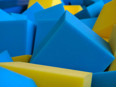 A large collection of foam blocks in various shades of blue and yellow
