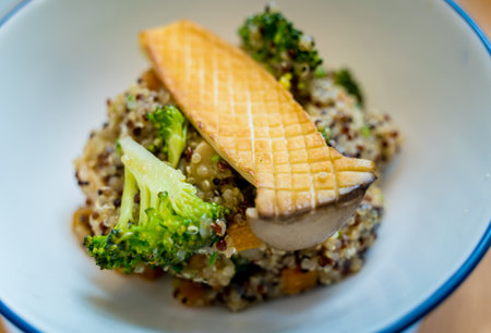 Healthy quinoa bowl with avocado, mushrooms and fresh vegetablesの写真素材