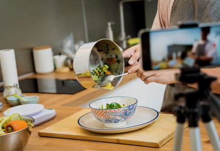 The chef is broadcasting live from workshop how to prepare a vegetarian green curry