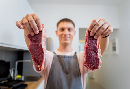 Raw fillet beef meat for steaks on the home electric grillの写真素材