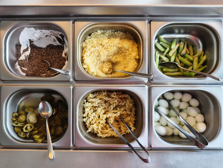 Buffet table stocked with an array of salads and veggies
