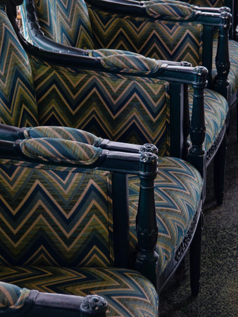 A stylish row of chairs with a chevron pattern bringing elegance to the room