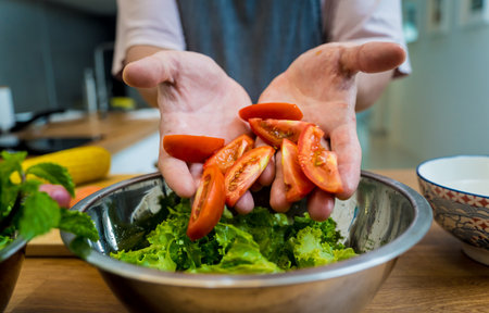 Chef at the kitchen preparing spicy glass noodle saladの写真素材
