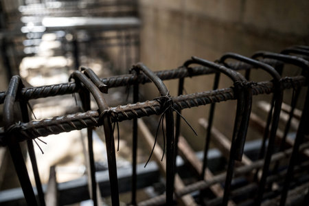 A construction site displaying a reinforced concrete foundation with steel rebar