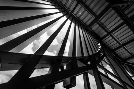 A structure featuring wooden slats on construction site contributing to its architectural styleの写真素材