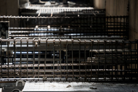 A construction site displaying a reinforced concrete foundation with steel rebar