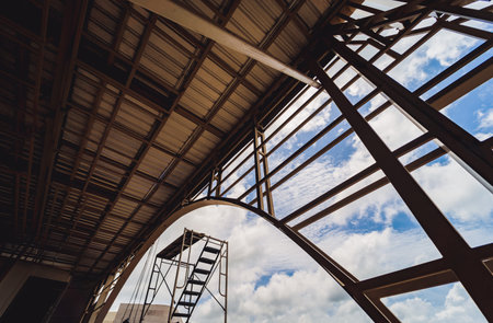 A structure featuring wooden slats on construction site contributing to its architectural style