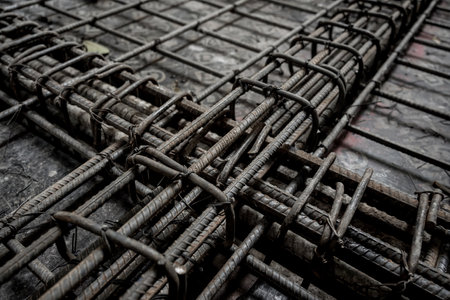 A construction site displaying a reinforced concrete foundation with steel rebarの写真素材
