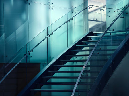 A modern stairway that features a significant amount of glassの写真素材