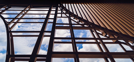 A structure featuring wooden slats on construction site contributing to its architectural styleの写真素材