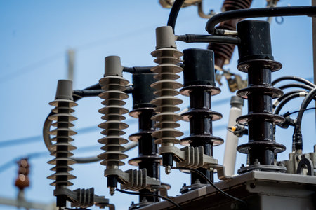 Various electrical equipment is set against a bright blue skyの写真素材