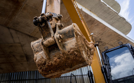 A significant pile of ground is being excavated by a bulldozerの写真素材