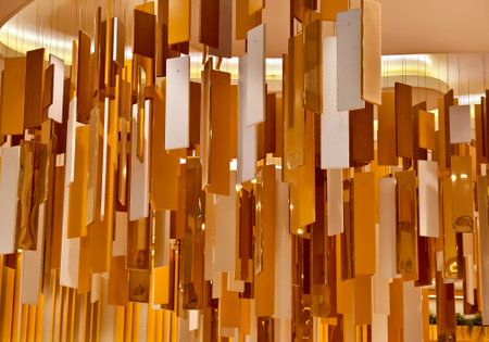 A beautifully colorful ceiling with a light fixture hanging from itの写真素材