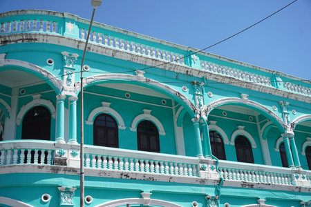 Detailed view of windows, doors and balconies of city buildingsの写真素材