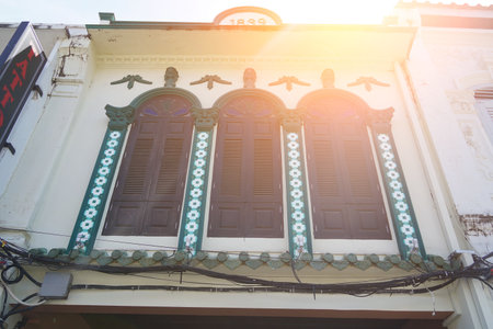 Detailed view of windows, doors and balconies of city buildingsの写真素材