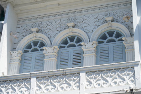 Detailed view of windows, doors and balconies of city buildingsの写真素材
