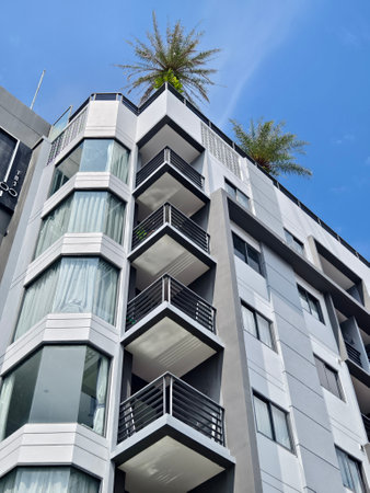 Detailed view of windows, doors and balconies of city buildingsの写真素材