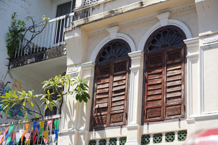 Detailed view of windows, doors and balconies of city buildingsの写真素材