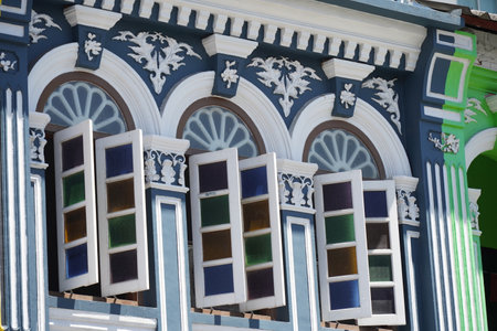 Detailed view of windows, doors and balconies of city buildingsの写真素材