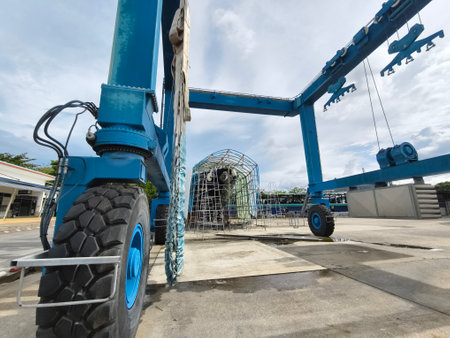A large blue gantry crane for boatsの写真素材