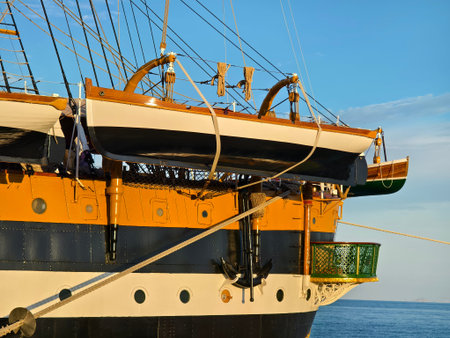 A large old ship at pier under a beautiful blue sky