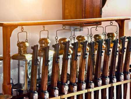 A row of decorative lanterns is lined up on a wooden rack