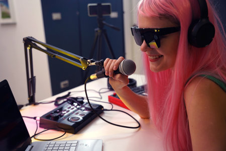 Content creator broadcasting from home studio setupの写真素材