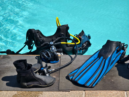 The ready for use scuba divers gear is on the pool edgeの写真素材