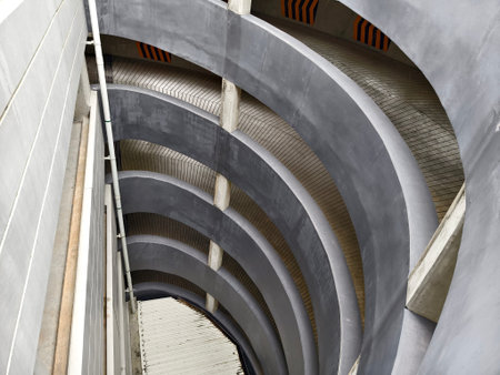 A spacious and modern parking garage with clean lines and abundant lighting.